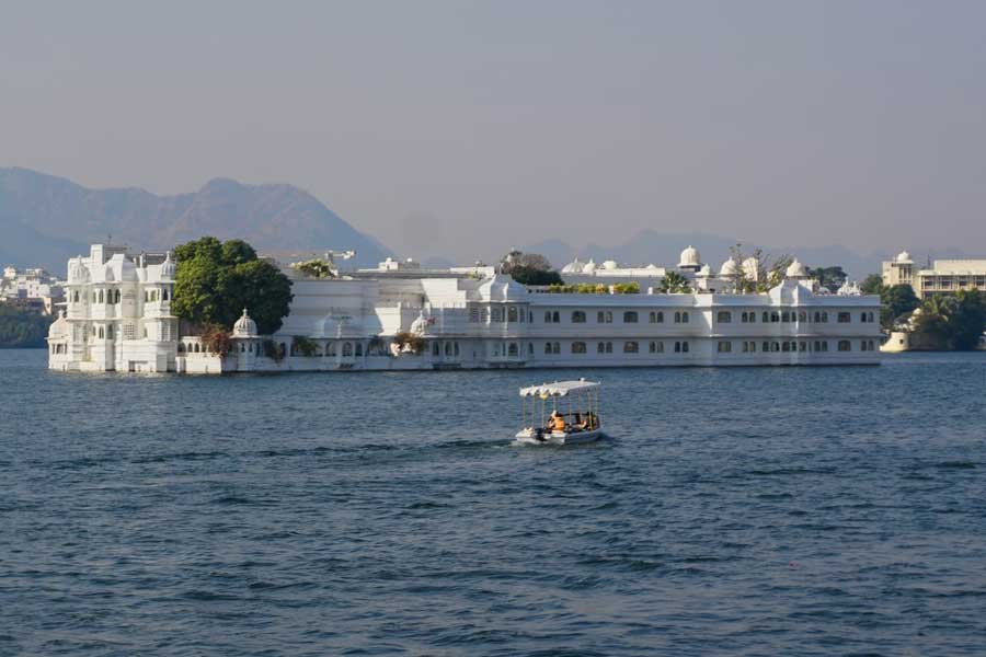 Lake Palace, a beautiful white heritage hotel located in the middle of Lake Pichola