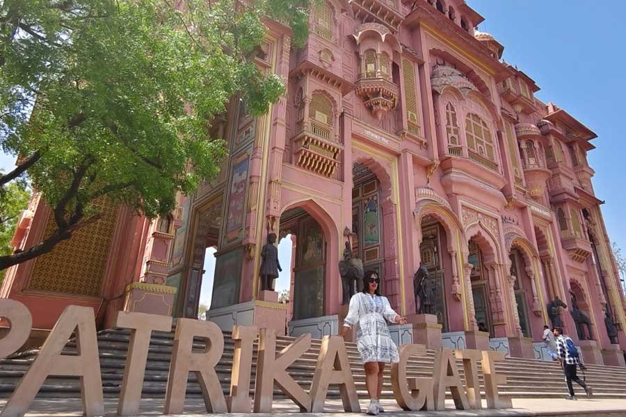 Patrika Gate in Jaipur, featuring beautiful pink Rajasthani architecture with grand arches and intricate design.