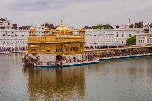 The Golden Temple, a famous Sikh shrine covered in gold and surrounded by a sacred water tank