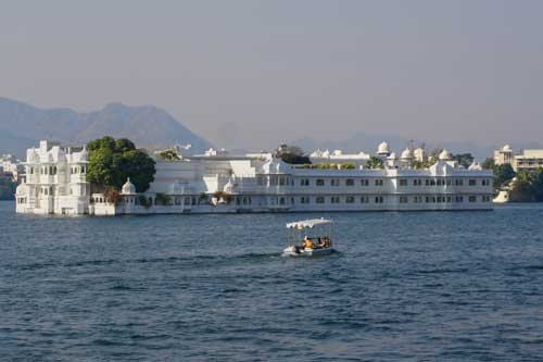 Lake Palace, a beautiful white heritage hotel located in the middle of Lake Pichola