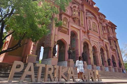Patrika Gate in Jaipur, featuring beautiful pink Rajasthani architecture with grand arches and intricate design.